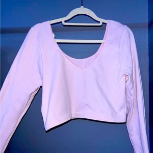 Light pink cropped long sleeve top
